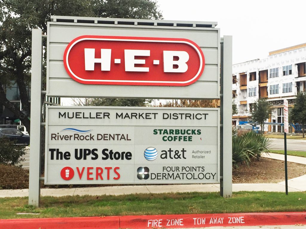 Sign showing Mueller Location - Dermatologist Austin, TX