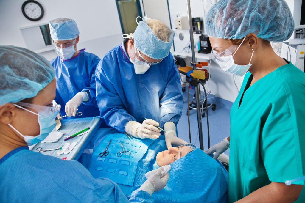 Surgical team beginning plastic surgery procedure