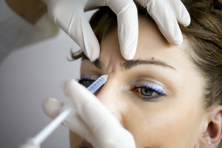 Patient receiving Dysport treatment between brows