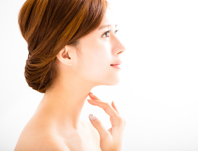 Young woman with youthful skin and neck. Mini neck lift. 