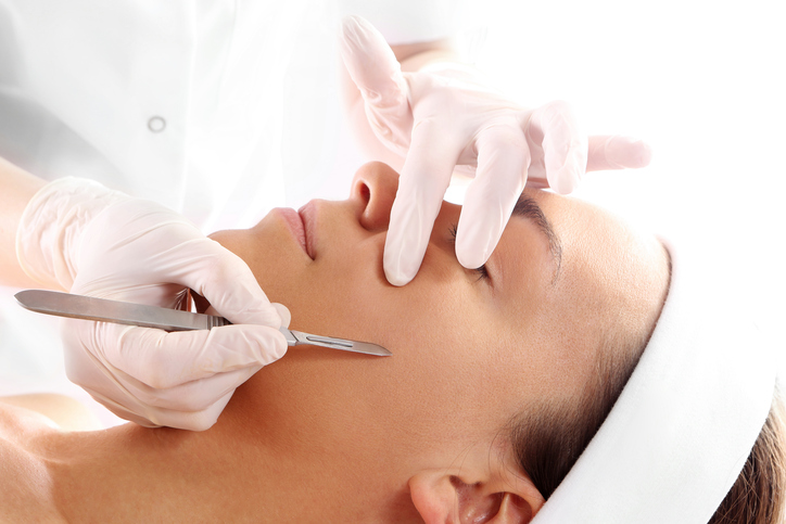 Patient undergoing dermaplaning procedure