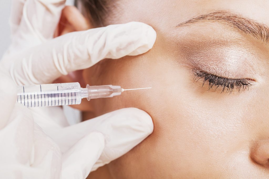 Close-up of woman receiving Botox treatment.