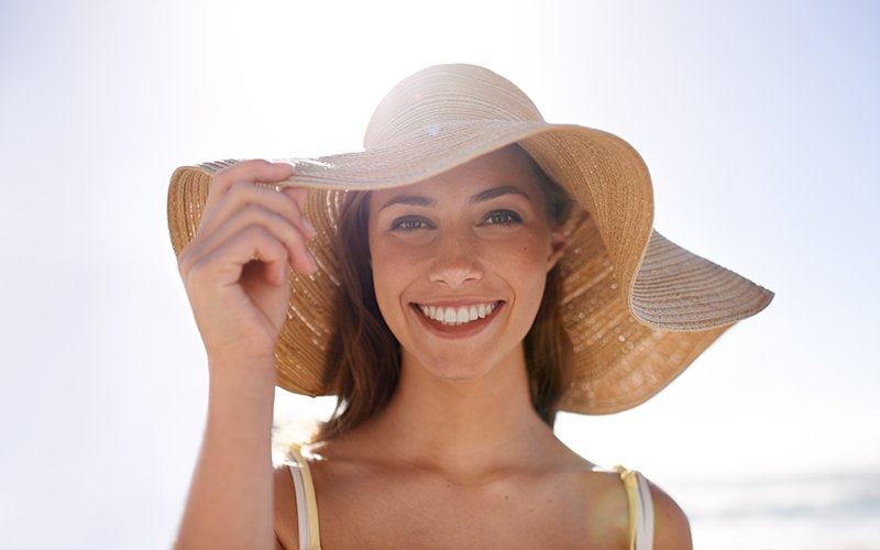 Woman Wearing a Hat to Prevent Getting Sabaceous Carcinoma