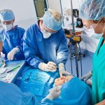 Surgical team beginning plastic surgery procedure