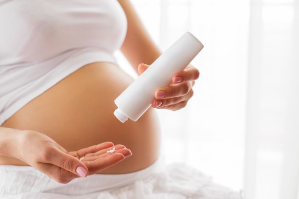 Woman treating skin conditions during pregnancy