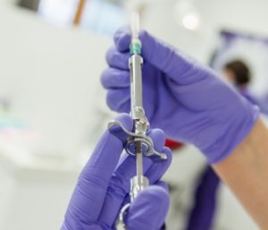 doctor handling syringe