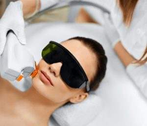 woman getting laser treatment