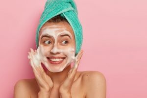 woman implementing at-home skincare routine