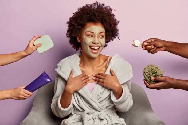 woman receiving products from family for at-home spa day