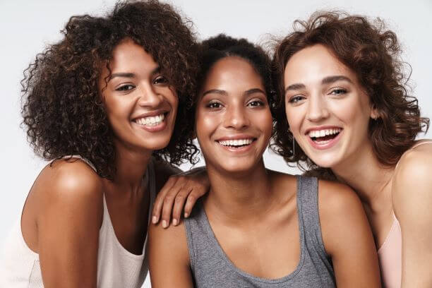 Three women -each with a different skin type