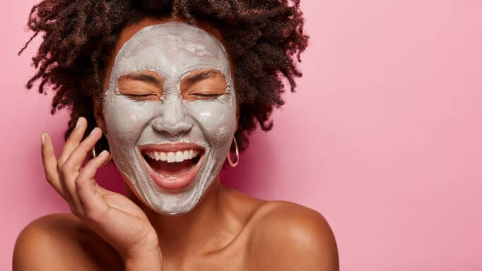 Woman using a skincare face mask