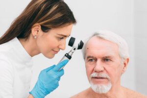 dermatologist examines a basal cell carcinoma